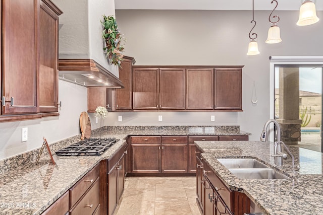 2255 N Hillridge, Mesa, AZ 85207 - kitchen featuring premium range hood, a sink, decorative light fixtures, light stone countertops, and stainless steel gas stovetop