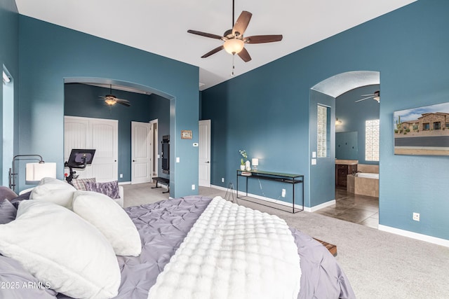 2255 N Hillridge, Mesa, AZ 85207 - bedroom featuring arched walkways, carpet, baseboards, ceiling fan, and ensuite bath