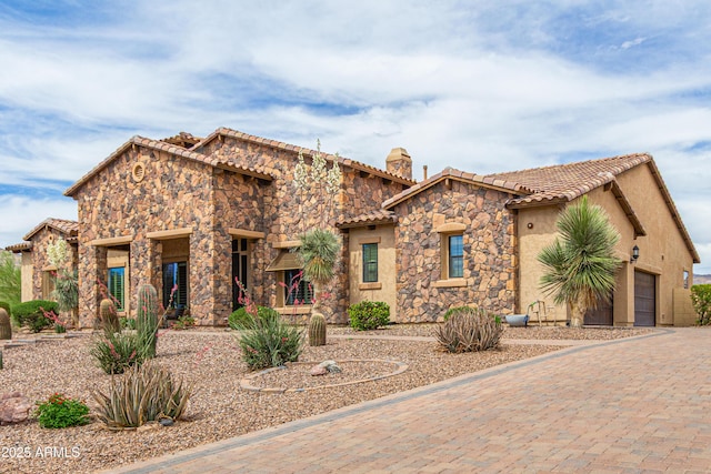 2255 N Hillridge, Mesa, AZ 85207 - mediterranean / spanish home with stone siding, a tiled roof, a chimney, and stucco siding