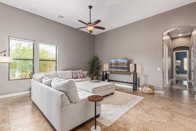 2255 N Hillridge, Mesa, AZ 85207 - living room featuring arched walkways, ceiling fan, and baseboards