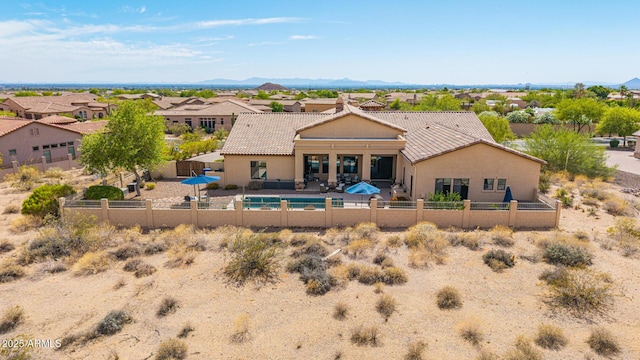 2255 N Hillridge, Mesa, AZ 85207 - back of property with a fenced backyard, a tile roof, stucco siding, and a residential view