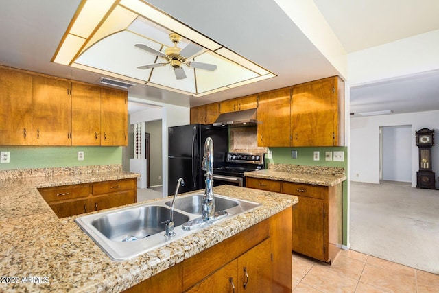 kitchen with ceiling fan, sink, black fridge, electric stove, and light carpet