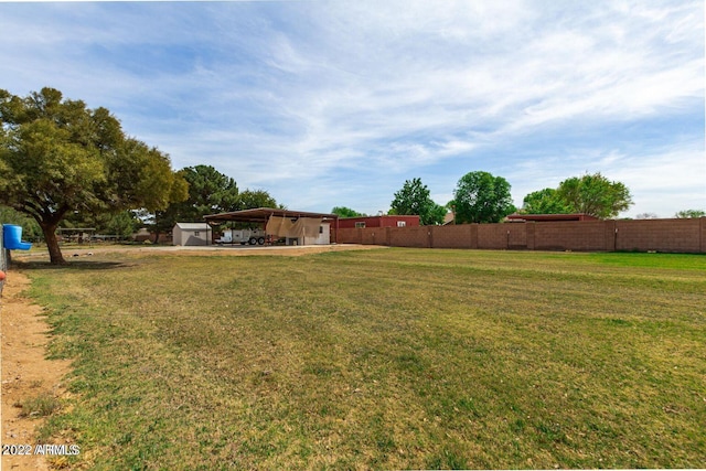 view of yard featuring a carport