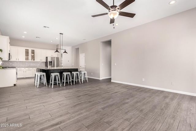 2409 W Red Range Way, Phoenix, AZ 85085 - living area featuring ceiling fan, light wood-style flooring, recessed lighting, and baseboards
