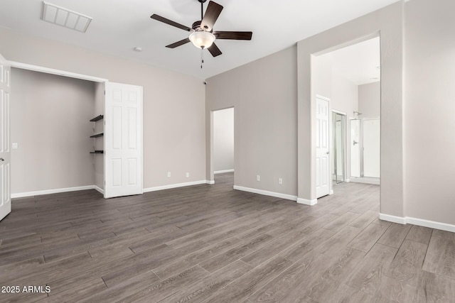 2409 W Red Range Way, Phoenix, AZ 85085 - unfurnished bedroom with wood finished floors, baseboards, and ceiling fan