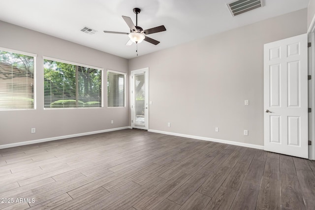 2409 W Red Range Way, Phoenix, AZ 85085 - unfurnished room featuring a ceiling fan, dark wood-style flooring, and baseboards