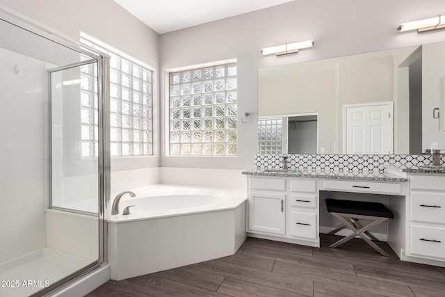 2409 W Red Range Way, Phoenix, AZ 85085 - full bath featuring a shower stall, a bath, tasteful backsplash, and vanity
