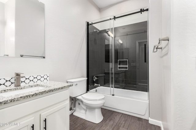 2409 W Red Range Way, Phoenix, AZ 85085 - full bath featuring wood finished floors, toilet, vanity, and bath / shower combo with glass door
