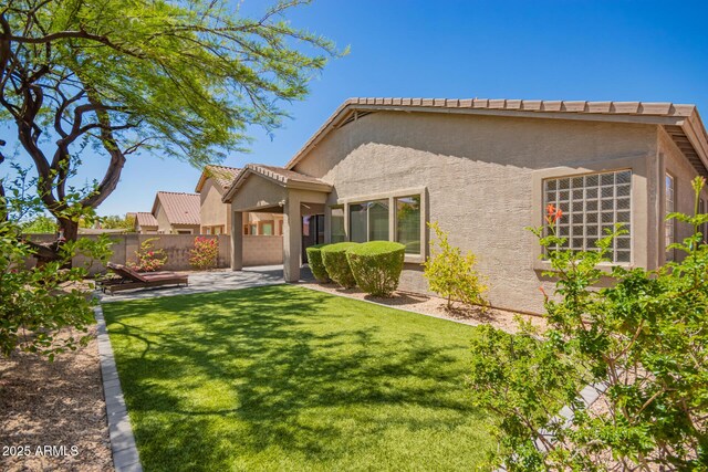2409 W Red Range Way, Phoenix, AZ 85085 - rear view of house featuring stucco siding, a patio area, and a tile roof