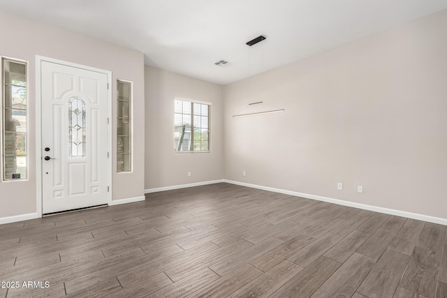 2409 W Red Range Way, Phoenix, AZ 85085 - entrance foyer featuring dark wood-style floors and baseboards