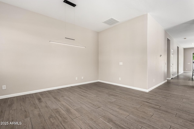 2409 W Red Range Way, Phoenix, AZ 85085 - unfurnished room with dark wood-style flooring and baseboards