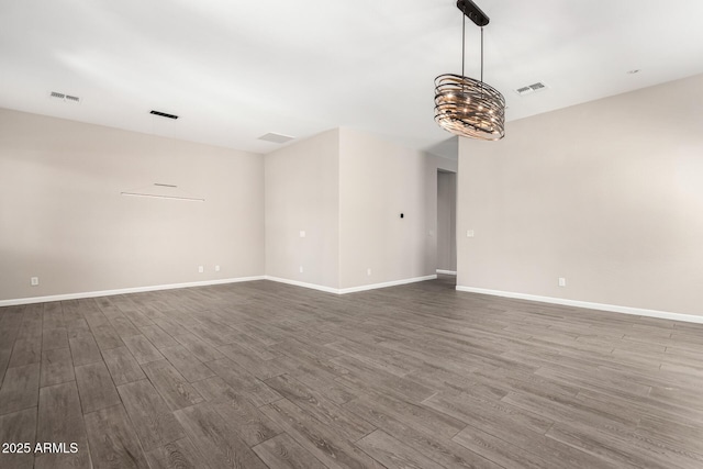 2409 W Red Range Way, Phoenix, AZ 85085 - spare room featuring dark wood-type flooring and baseboards