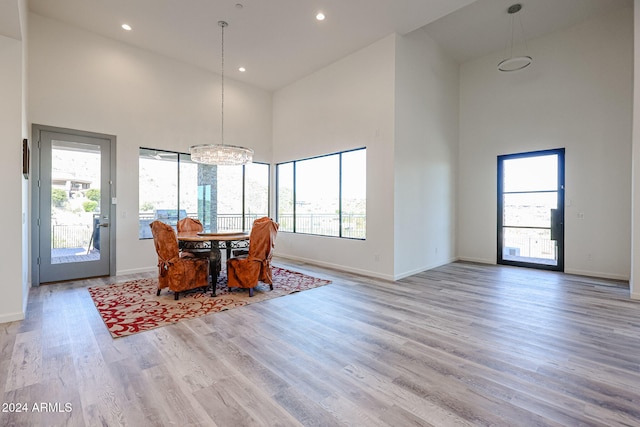 dining space featuring a wealth of natural light and high vaulted ceiling