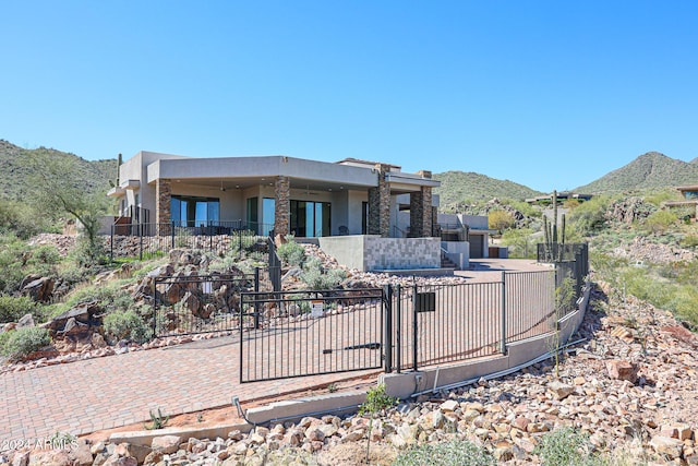 14914 E Zapata Dr, Fountain Hills, AZ 85268 - view of front of home featuring stucco siding, a mountain view, and fence