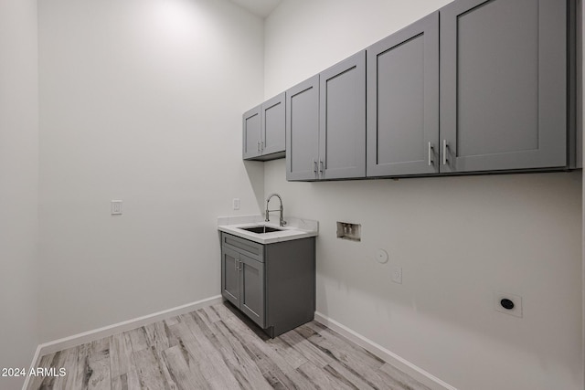14914 E Zapata Dr, Fountain Hills, AZ 85268 - clothes washing area with electric dryer hookup, cabinet space, hookup for a washing machine, light wood-style floors, and baseboards