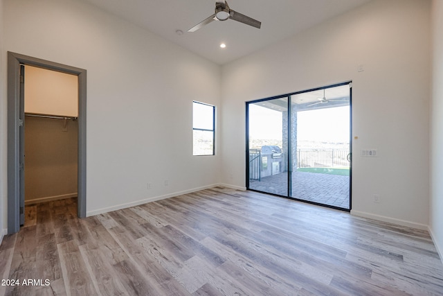 unfurnished room featuring ceiling fan and light hardwood / wood-style flooring