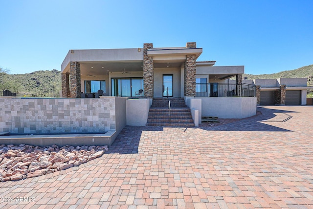 14914 E Zapata Dr, Fountain Hills, AZ 85268 - view of front of property featuring stucco siding, a ceiling fan, a mountain view, and stone siding