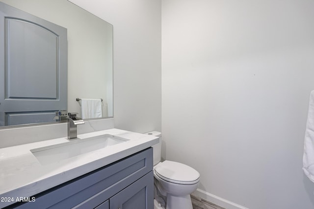 14914 E Zapata Dr, Fountain Hills, AZ 85268 - bathroom featuring toilet, vanity, baseboards, and wood finished floors