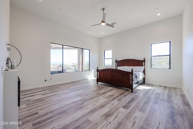 bedroom with ceiling fan and light hardwood / wood-style floors