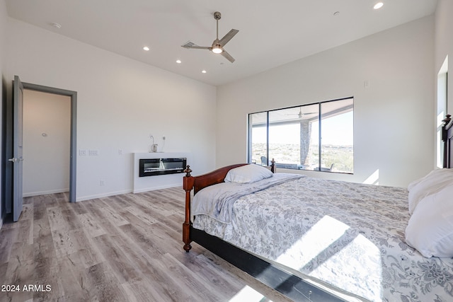 bedroom featuring ceiling fan and light hardwood / wood-style flooring