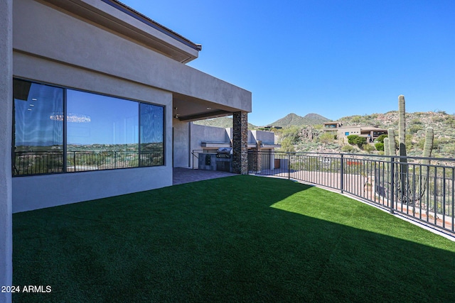 14914 E Zapata Dr, Fountain Hills, AZ 85268 - view of yard featuring an outdoor kitchen, a patio area, and a mountain view