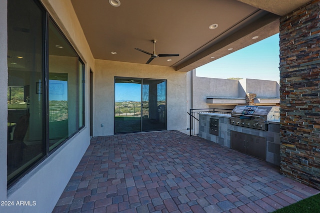 view of patio / terrace featuring area for grilling, a grill, and ceiling fan