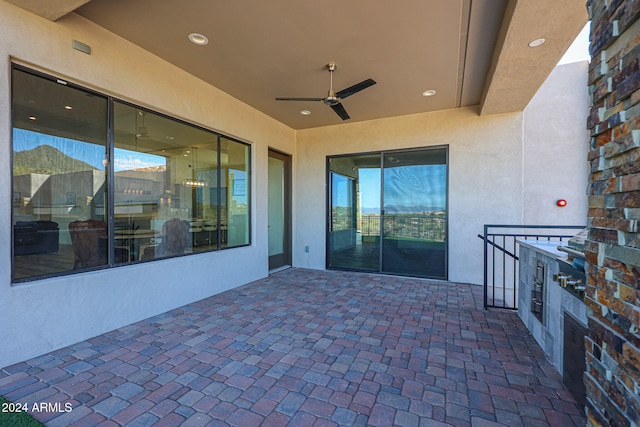 view of patio featuring ceiling fan