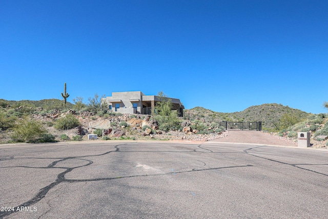 14914 E Zapata Dr, Fountain Hills, AZ 85268 - view of asphalt road with a mountain view and a gate