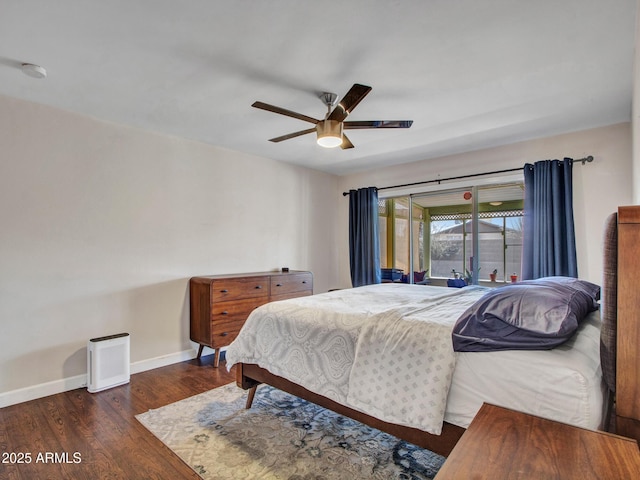 bedroom featuring access to exterior, baseboards, dark wood finished floors, and a ceiling fan