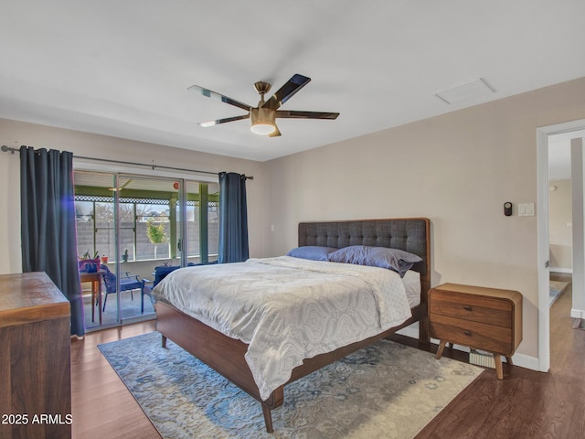 bedroom featuring a ceiling fan, access to outside, baseboards, and wood finished floors