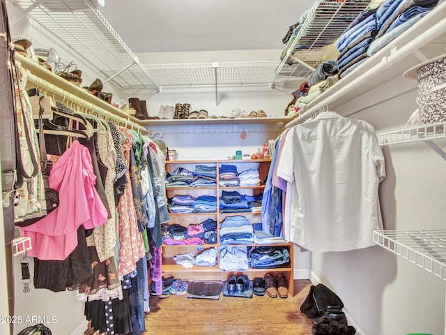 spacious closet featuring wood finished floors