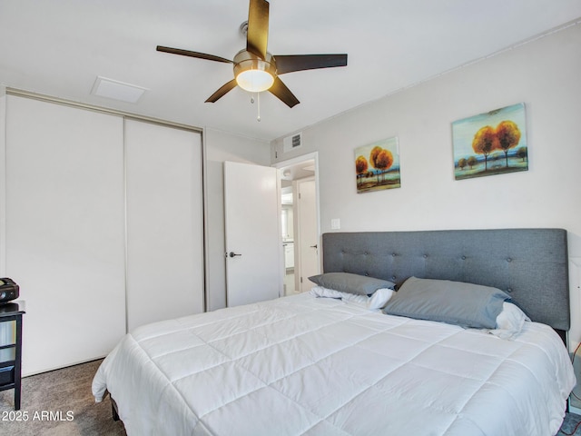 bedroom with ceiling fan, a closet, visible vents, and carpet flooring