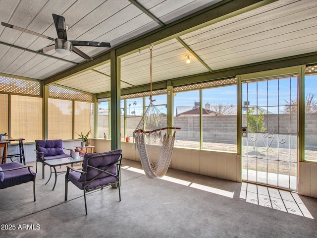 sunroom featuring ceiling fan