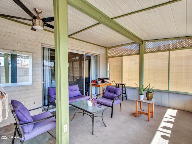 sunroom with beamed ceiling