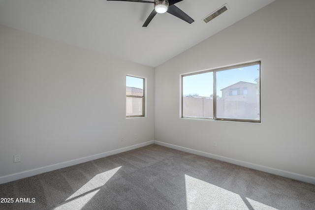 empty room featuring carpet flooring, ceiling fan, and lofted ceiling