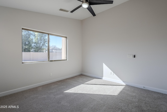 spare room with light colored carpet and ceiling fan