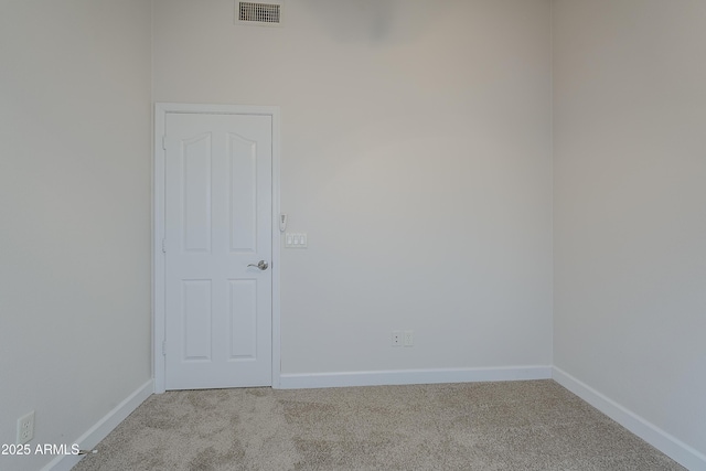 empty room featuring light carpet