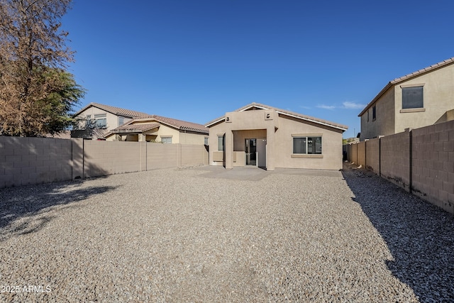 rear view of house featuring a patio