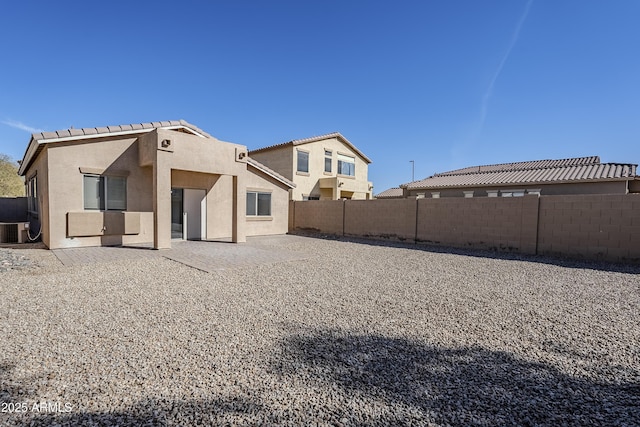 rear view of property featuring a patio