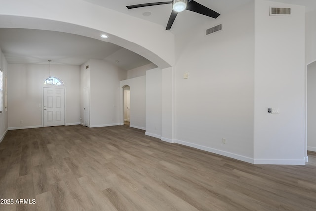 interior space with light hardwood / wood-style flooring, ceiling fan, and lofted ceiling