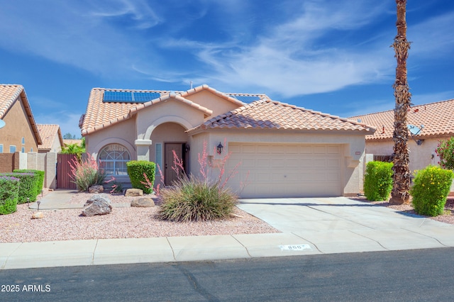 866 W Geronimo St, Chandler, AZ 85225 - mediterranean / spanish home featuring an attached garage, a tiled roof, stucco siding, and concrete driveway