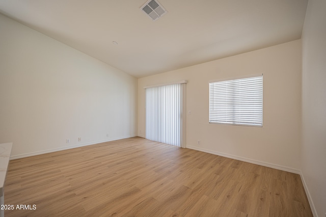866 W Geronimo St, Chandler, AZ 85225 - unfurnished room featuring light wood finished floors, baseboards, and lofted ceiling