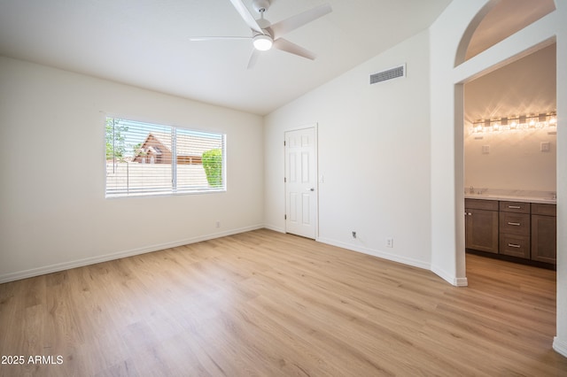 866 W Geronimo St, Chandler, AZ 85225 - unfurnished bedroom with light wood-style flooring, baseboards, connected bathroom, ceiling fan, and high vaulted ceiling