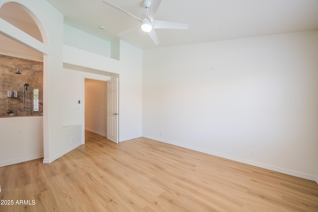 866 W Geronimo St, Chandler, AZ 85225 - spare room with light wood-type flooring, vaulted ceiling, ceiling fan, and baseboards