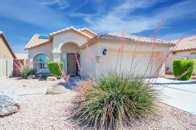 866 W Geronimo St, Chandler, AZ 85225 - mediterranean / spanish home with a garage, a tiled roof, stucco siding, concrete driveway, and roof mounted solar panels