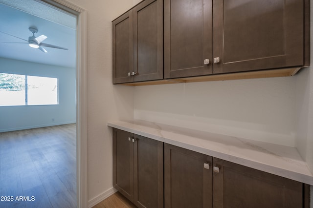 866 W Geronimo St, Chandler, AZ 85225 - bar featuring light wood finished floors, ceiling fan, and baseboards