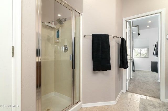 bathroom featuring tile patterned flooring and a shower with door