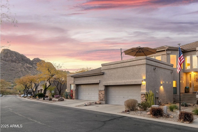 exterior space with a mountain view and a garage