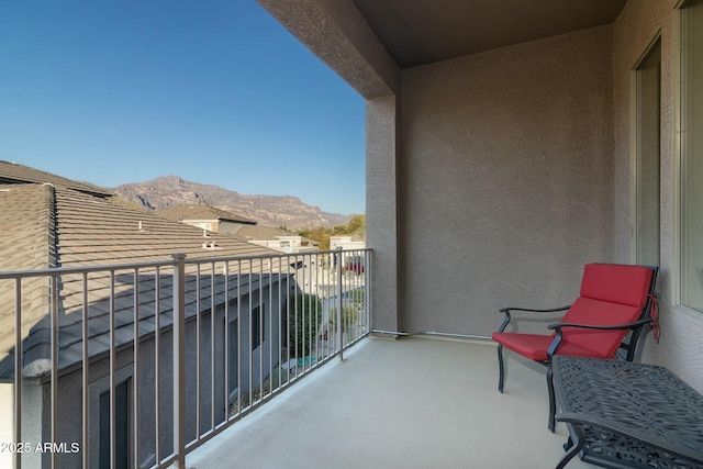 balcony featuring a mountain view