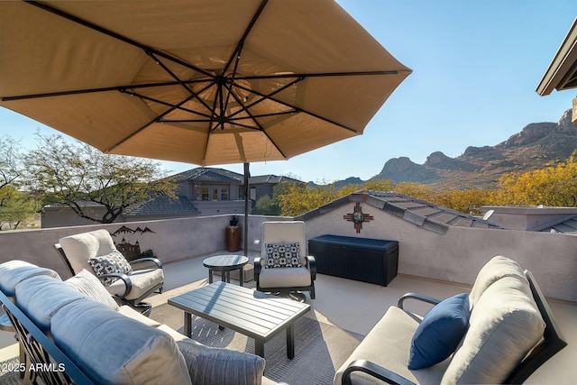 view of patio with a mountain view and an outdoor hangout area